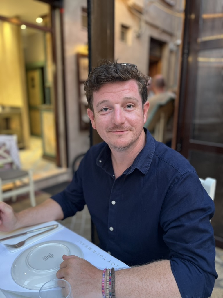 Neil Bentley smiling at a café